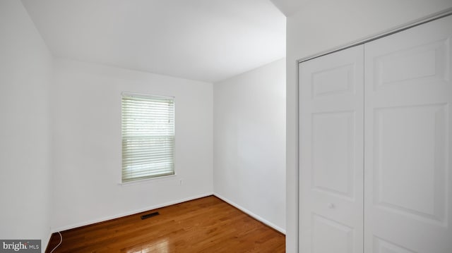 13413 Winterspoon Ln, Germantown, MD 20874 - unfurnished bedroom with wood finished floors and a closet
