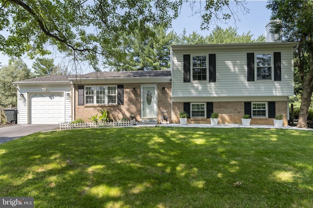 13413 Winterspoon Ln, Germantown, MD 20874 - split level home with brick siding, a garage, asphalt driveway, and a front yard