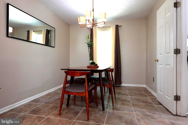 8307 Satinleaf Ct, Bowie, MD 20715 - tiled dining area with a chandelier and baseboards