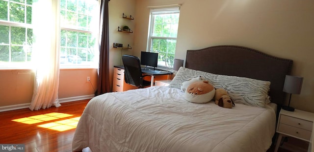 8307 Satinleaf Ct, Bowie, MD 20715 - bedroom featuring baseboards and wood finished floors