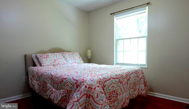 8307 Satinleaf Ct, Bowie, MD 20715 - bedroom with baseboards and wood finished floors