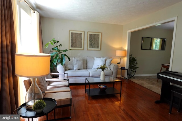 8307 Satinleaf Ct, Bowie, MD 20715 - living room featuring hardwood / wood-style flooring and a textured ceiling