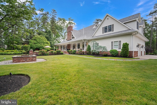14 Waterfront Way, Hammonton, NJ 08037 - view of front of house with a chimney, a front lawn, roof with shingles, a garage, and a porch