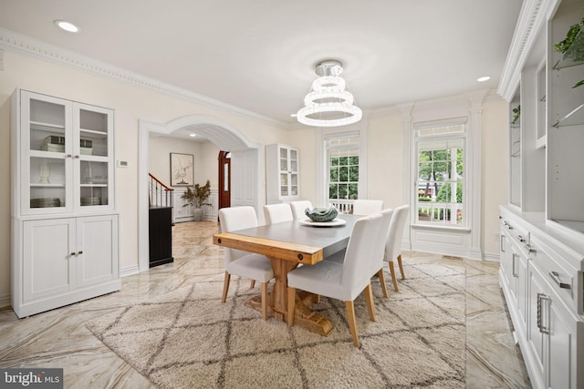 14 Waterfront Way, Hammonton, NJ 08037 - dining room with light marble finish flooring, a chandelier, arched walkways, recessed lighting, and ornamental molding