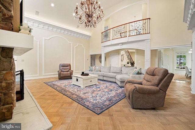 14 Waterfront Way, Hammonton, NJ 08037 - living room featuring a high ceiling, arched walkways, and a chandelier