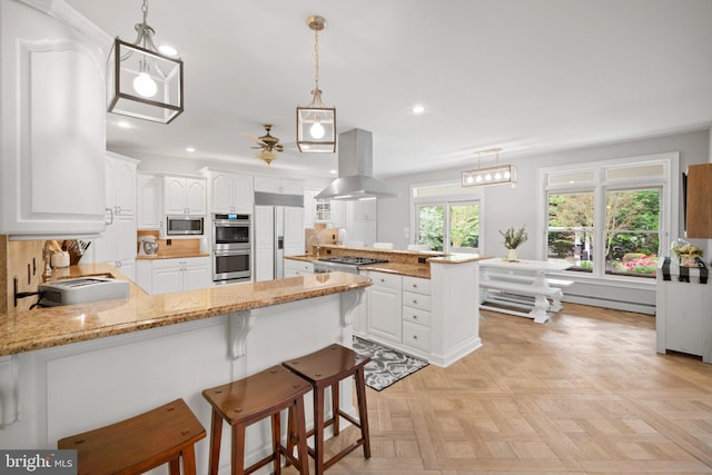 14 Waterfront Way, Hammonton, NJ 08037 - kitchen featuring a peninsula, island range hood, built in appliances, recessed lighting, and white cabinetry