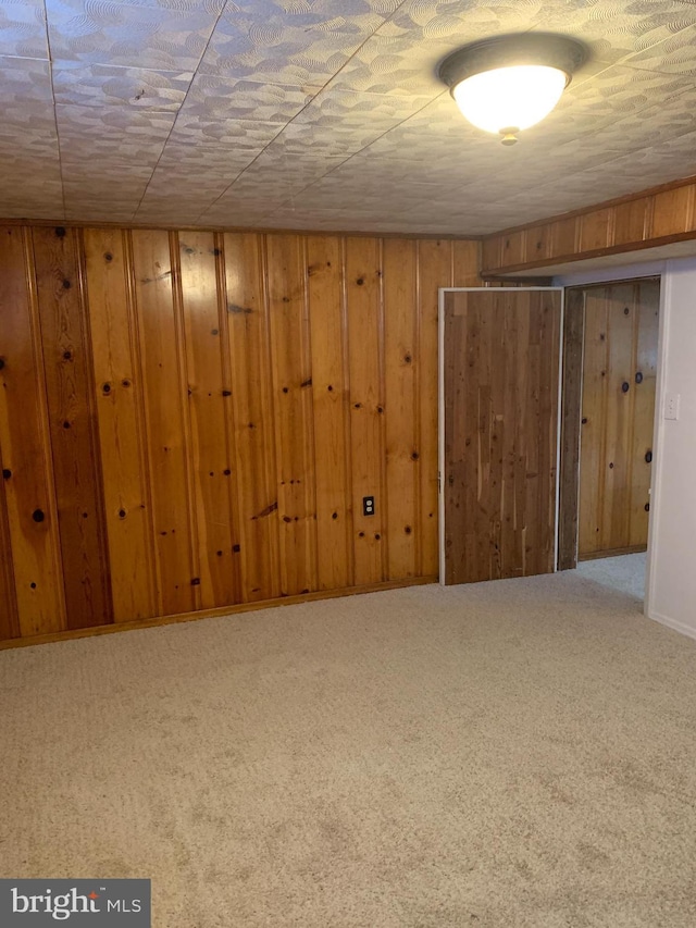 3918 Dudley Ave, Baltimore, MD 21213 - finished below grade area with wooden walls and carpet flooring