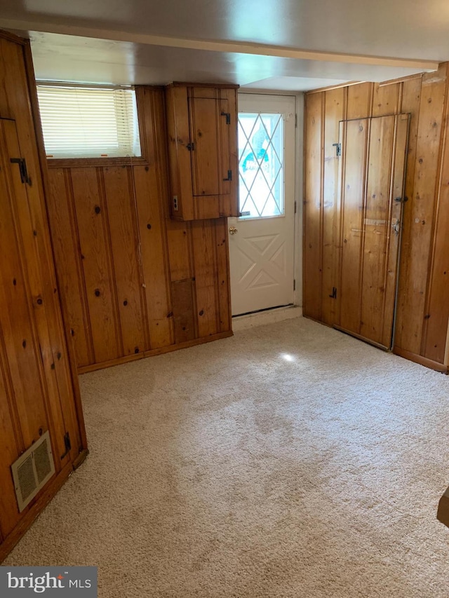 3918 Dudley Ave, Baltimore, MD 21213 - carpeted foyer entrance with wood walls