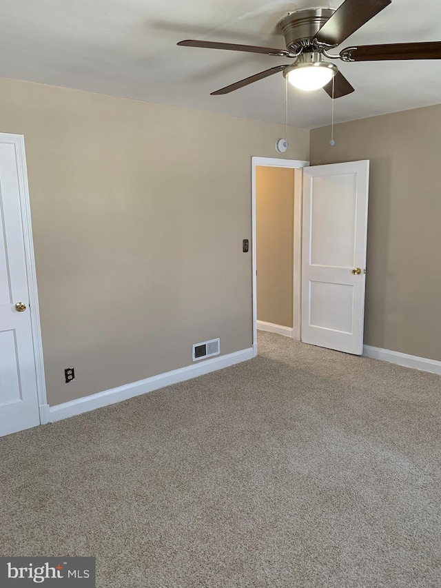 3918 Dudley Ave, Baltimore, MD 21213 - carpeted empty room with ceiling fan, baseboards, and a smoke detector