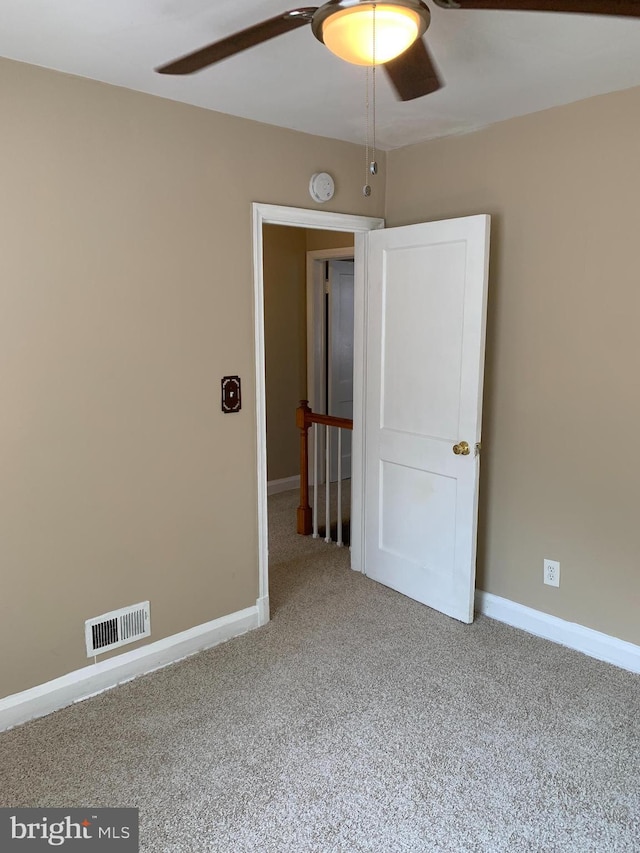 3918 Dudley Ave, Baltimore, MD 21213 - unfurnished room featuring ceiling fan, carpet floors, baseboards, and a smoke detector