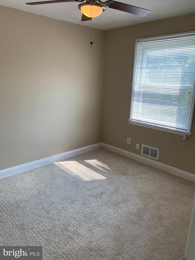 3918 Dudley Ave, Baltimore, MD 21213 - empty room with ceiling fan, baseboards, and carpet