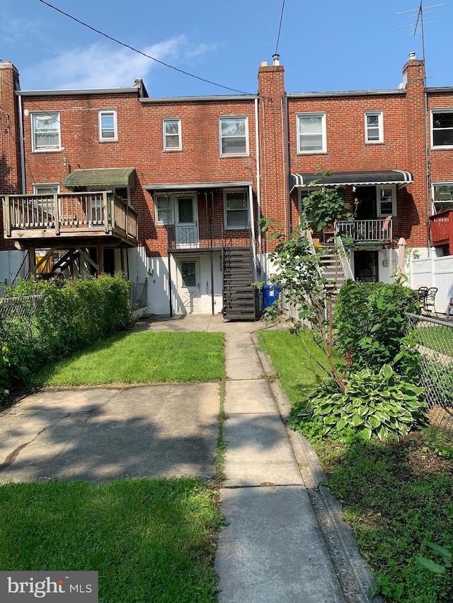 3918 Dudley Ave, Baltimore, MD 21213 - rear view of property with stairs and brick siding