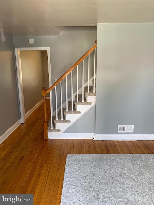 3918 Dudley Ave, Baltimore, MD 21213 - staircase with wood finished floors and baseboards