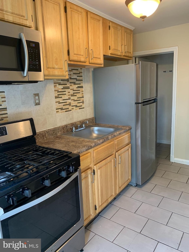 3918 Dudley Ave, Baltimore, MD 21213 - kitchen with appliances with stainless steel finishes, a sink, decorative backsplash, dark countertops, and light tile patterned flooring