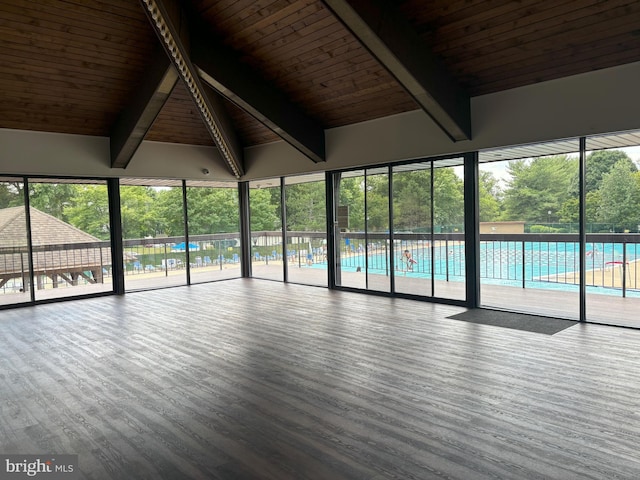 18302 Streamside Dr Unit 101, Gaithersburg, MD 20879 - unfurnished living room featuring wooden ceiling, wood finished floors, and plenty of natural light