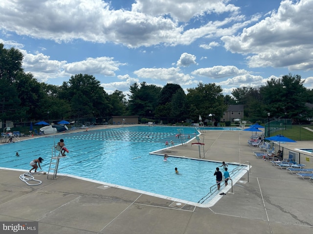 18302 Streamside Dr Unit 101, Gaithersburg, MD 20879 - community pool with a patio area
