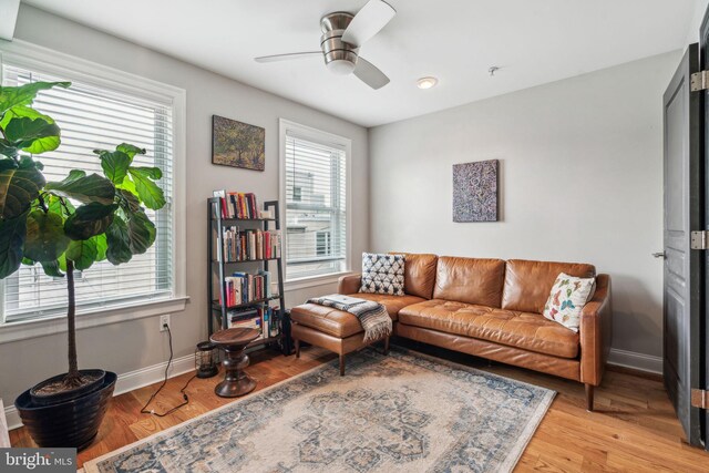 1444 N Myrtlewood St, Philadelphia, PA 19121 - living room featuring a ceiling fan, light wood finished floors, and baseboards