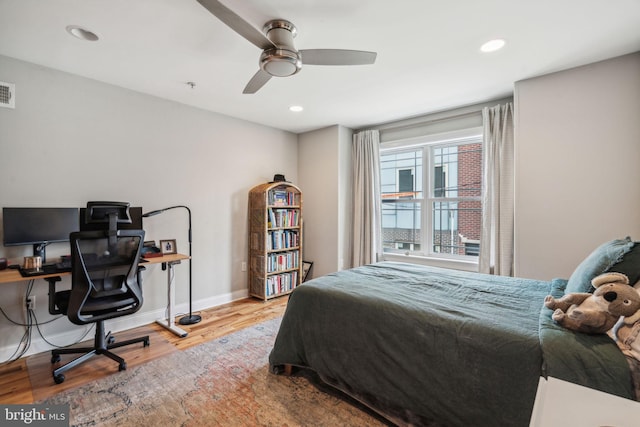 1444 N Myrtlewood St, Philadelphia, PA 19121 - bedroom with wood finished floors, recessed lighting, a desk, baseboards, and ceiling fan