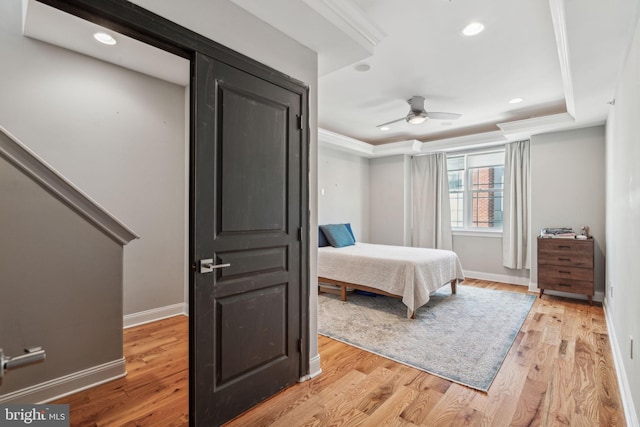 1444 N Myrtlewood St, Philadelphia, PA 19121 - bedroom featuring baseboards, light wood finished floors, ornamental molding, recessed lighting, and a raised ceiling