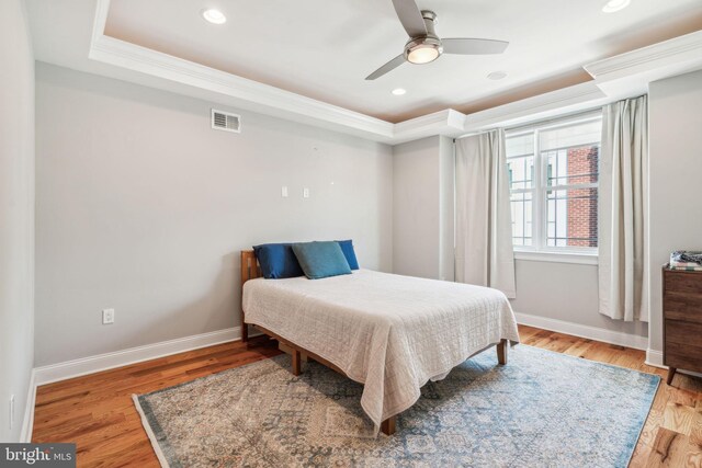 1444 N Myrtlewood St, Philadelphia, PA 19121 - bedroom with a tray ceiling, baseboards, ornamental molding, wood finished floors, and recessed lighting