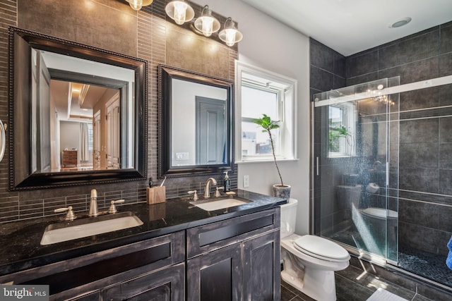 1444 N Myrtlewood St, Philadelphia, PA 19121 - bathroom featuring toilet, double vanity, a shower stall, and backsplash