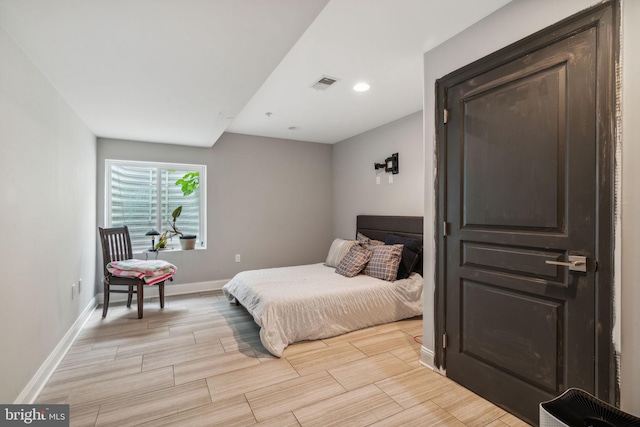 1444 N Myrtlewood St, Philadelphia, PA 19121 - bedroom with baseboards, wood tiled floors, and recessed lighting