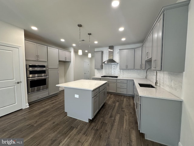 21 Kay Chiarello Way, Hamilton, NJ 08690 - kitchen with gray cabinetry, wall chimney exhaust hood, a sink, black gas cooktop, and double oven
