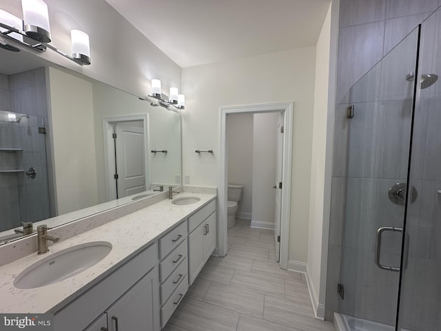 21 Kay Chiarello Way, Hamilton, NJ 08690 - bathroom with toilet, double vanity, a stall shower, and baseboards