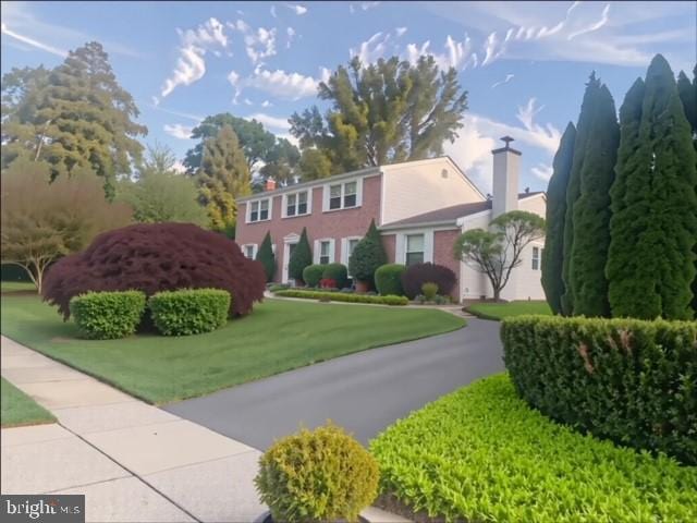 7810 Cobden Rd, Laverock, PA 19038 - view of front of property with a chimney and a front yard