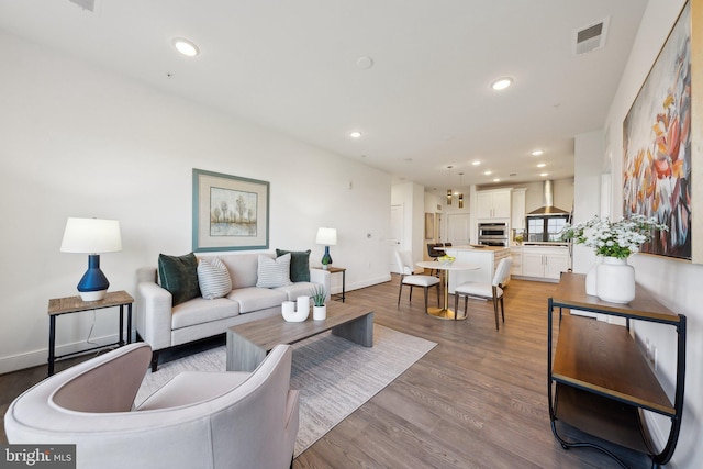 210 Decoverly Dr Unit 407, Gaithersburg, MD 20878 - living area featuring wood finished floors, recessed lighting, and baseboards