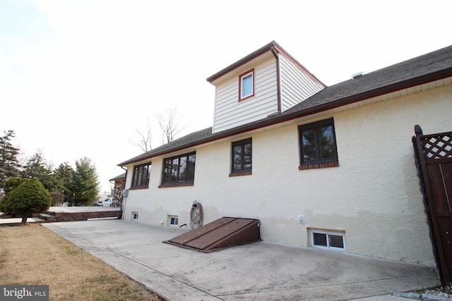 2732 Old Cedar Grove Rd, Broomall, PA 19008 - back of property with a patio, stucco siding, and a shingled roof
