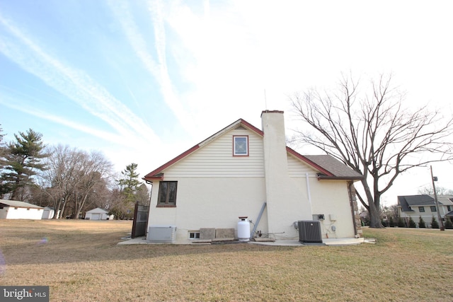 2732 Old Cedar Grove Rd, Broomall, PA 19008 - view of side of property with a lawn, a chimney, and cooling unit