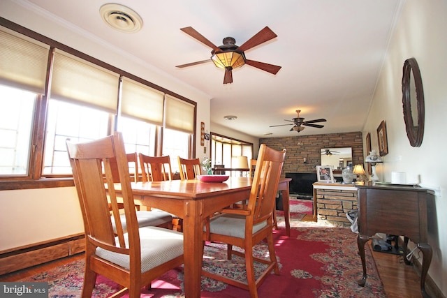 2732 Old Cedar Grove Rd, Broomall, PA 19008 - dining room with a ceiling fan, wood finished floors, baseboards, and a fireplace
