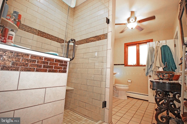 2732 Old Cedar Grove Rd, Broomall, PA 19008 - full bath with a baseboard heating unit, a ceiling fan, a stall shower, tile walls, and toilet
