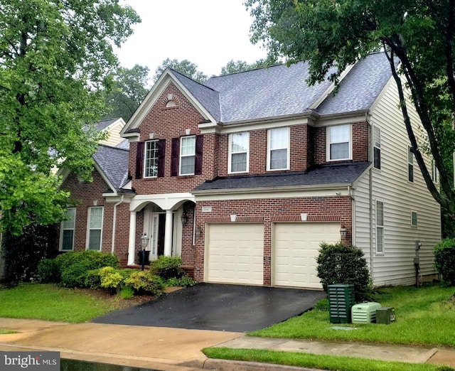 8411 Whitehaven Ct, Lorton, VA 22079 - view of front of property with driveway, a garage, brick siding, and a shingled roof