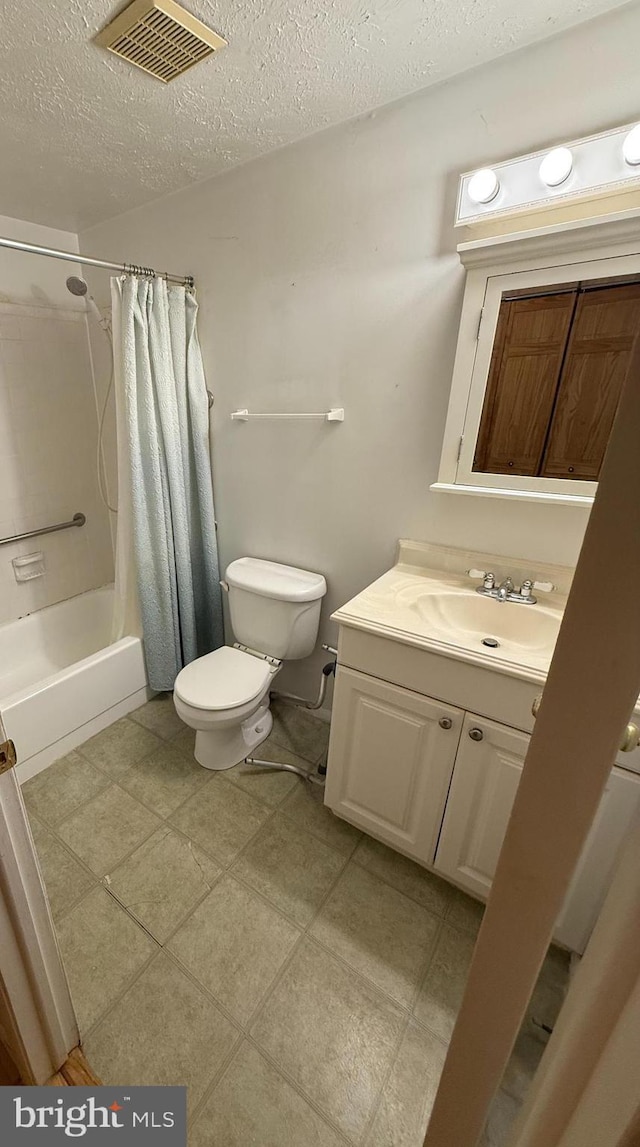 8406 Rainbow Bridge Ln, Springfield, VA 22153 - full bathroom featuring vanity, a textured ceiling, and shower / bath combination with curtain