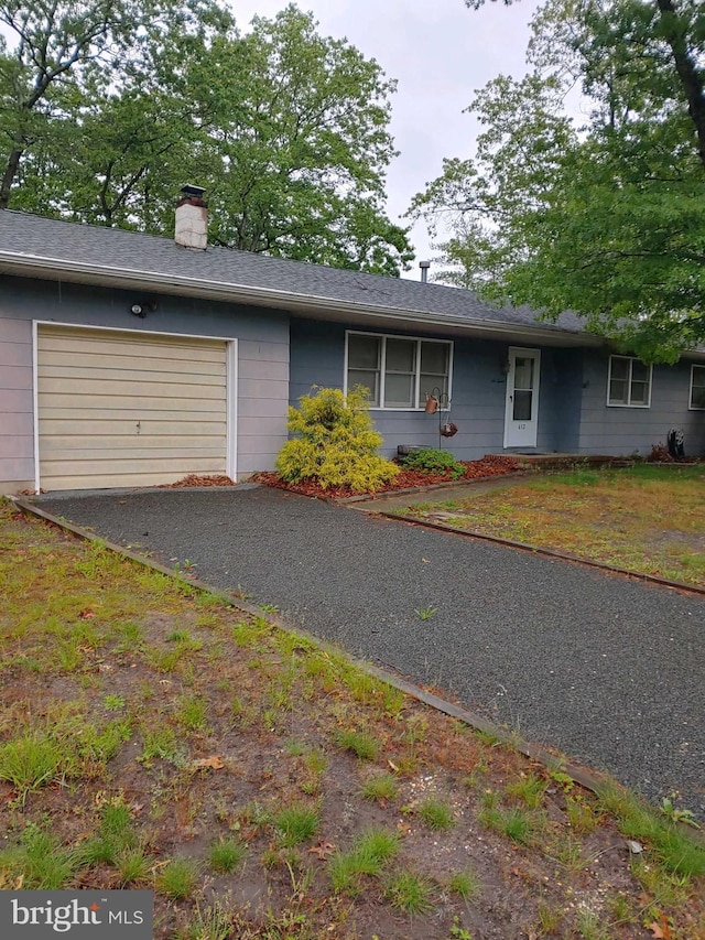 612 Deerhead Lake Dr, Forked River, NJ 08731 - ranch-style house featuring an attached garage, asphalt driveway, and a chimney
