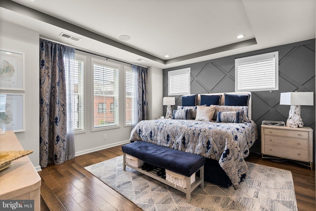 1741 Mckenna Point Dr Unit 2701, Mclean, VA 22102 - bedroom featuring a raised ceiling, wood finished floors, a decorative wall, and recessed lighting