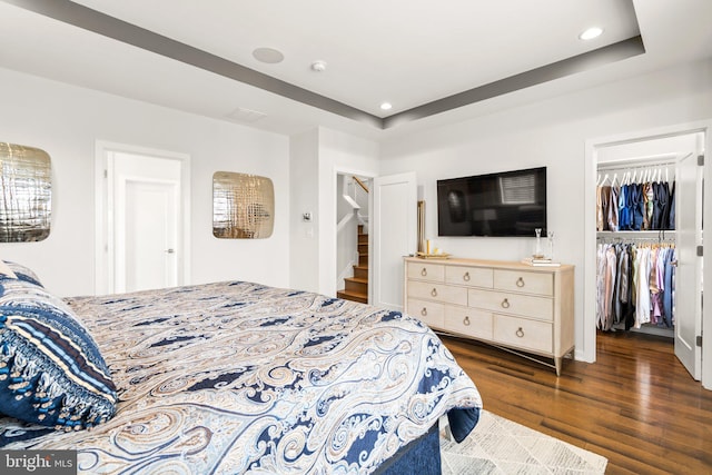 1741 Mckenna Point Dr Unit 2701, Mclean, VA 22102 - bedroom featuring dark wood finished floors, recessed lighting, a walk in closet, a closet, and a tray ceiling