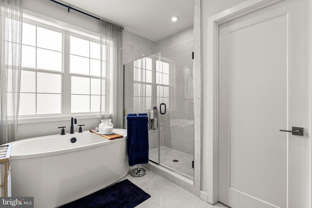 1741 Mckenna Point Dr Unit 2701, Mclean, VA 22102 - bathroom with marble look tile flooring, a soaking tub, a shower stall, and recessed lighting