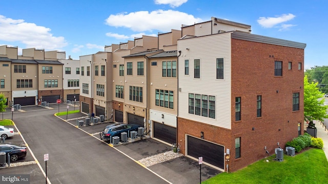 1741 Mckenna Point Dr Unit 2701, Mclean, VA 22102 - view of property with a garage, driveway, and a residential view