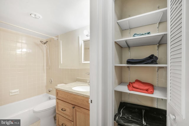 2939 Van Ness St NW Unit 608, Washington, DC 20008 - bathroom with vanity, tub / shower combination, tile walls, and toilet
