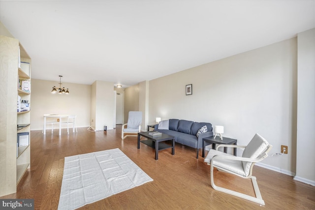 2939 Van Ness St NW Unit 608, Washington, DC 20008 - living area featuring wood finished floors, a chandelier, and baseboards