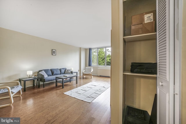 2939 Van Ness St NW Unit 608, Washington, DC 20008 - living area featuring wood finished floors and radiator heating unit