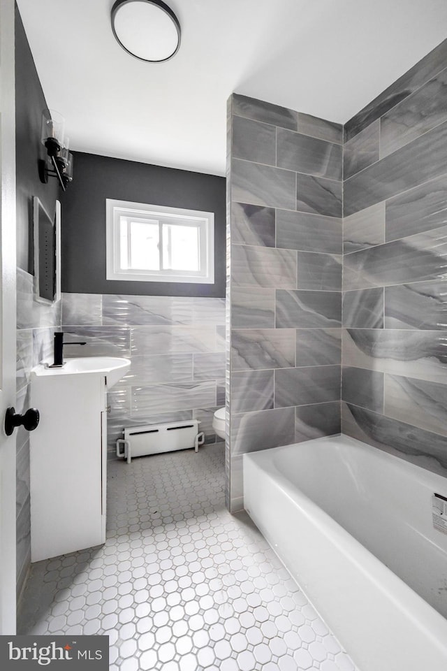 170 Drexel Ave, Lansdowne, PA 19050 - bathroom featuring a baseboard heating unit, vanity, toilet, tile walls, and shower / bath combination