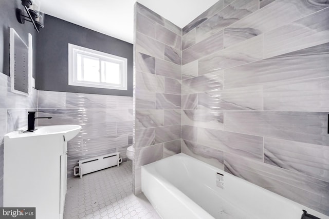 170 Drexel Ave, Lansdowne, PA 19050 - full bath with a baseboard heating unit, tile walls, vanity, a bathtub, and tile patterned flooring