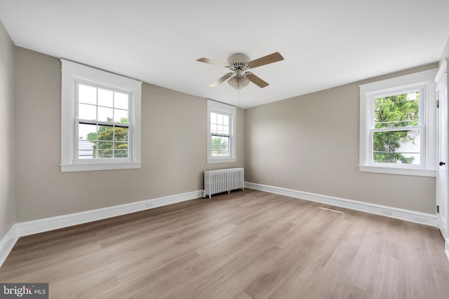 170 Drexel Ave, Lansdowne, PA 19050 - empty room with radiator heating unit, ceiling fan, light wood-style flooring, and baseboards