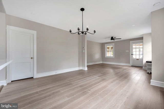 170 Drexel Ave, Lansdowne, PA 19050 - spare room featuring a chandelier, ceiling fan, light wood-style floors, and baseboards