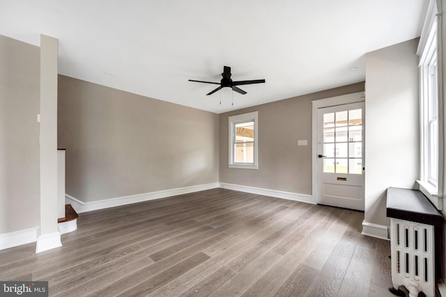 170 Drexel Ave, Lansdowne, PA 19050 - unfurnished living room featuring wood finished floors, ceiling fan, and baseboards