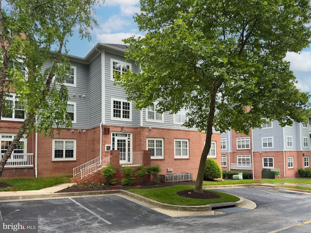 8723 Groffs Mill Dr Unit 8723, Owings Mills, MD 21117 - view of property with uncovered parking